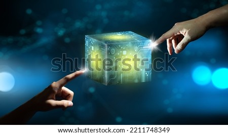 Businessman hands pointing Cube technology with Abstract blue background. Blockchain Network System. Big data storage processing, Cloud data, Internet Security, and Digital Technology.