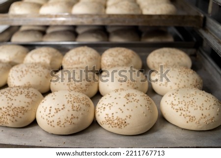 Industrial production round hamburger buns in the bakery
