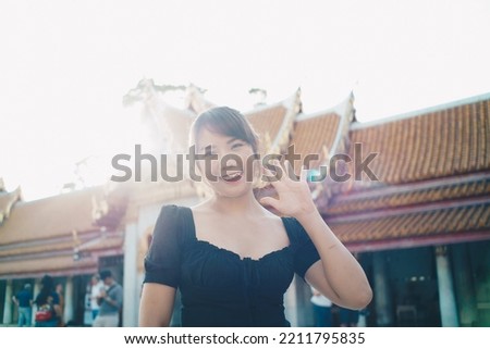 Tourist asian backpack woman tracel in buddhist temple sightseeing in Bangkok Thailand Royalty-Free Stock Photo #2211795835
