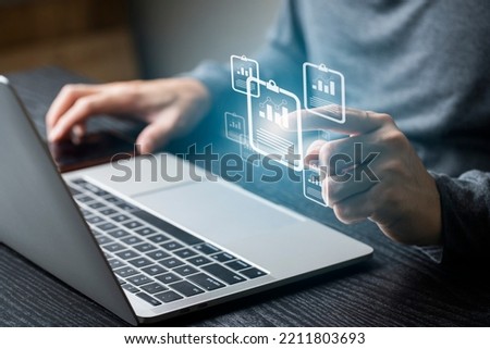 E-signing on e document and virtual notepad on virtual screen , Businessman using computer laptop on e document on digital tablet , electronic signature , paperless office concept