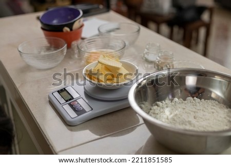 Scale with butter and ingredients to prepare bread