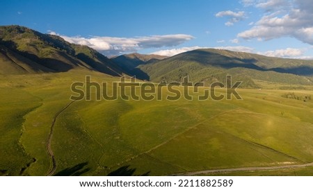 Summer mountain landscape at sunset. Mountain landscape from a height at sunset. Photos of the Republic of Gorny Altai in summer, aerial photography, Russia