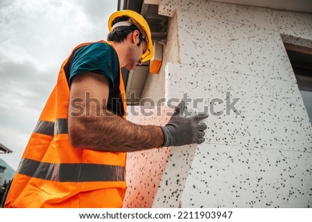 Polystyrene thermal cladding for energy saving on a construction site Royalty-Free Stock Photo #2211903947
