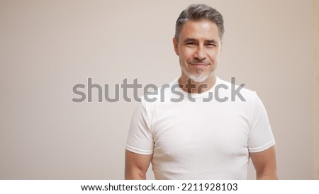 Portrait of happy casual older man smiling, Mid adult, mature age guy with gray hair, Isolated on white background, copy space. Royalty-Free Stock Photo #2211928103