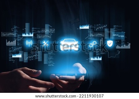 The concept of smart machine control through a smartphone and other devices with a hologram over Royalty-Free Stock Photo #2211930107