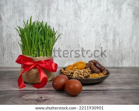 Festive table in honor of Navruz. Wheat with a red ribbon, the traditional holiday of the vernal equinox Nawruz