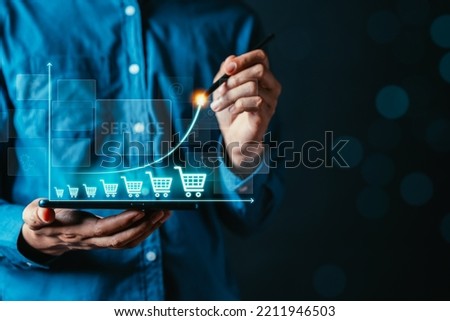 E-Shop Growth up, sale online, delivery concept. Businessman drawing line for best shipping and contact service. Royalty-Free Stock Photo #2211946503