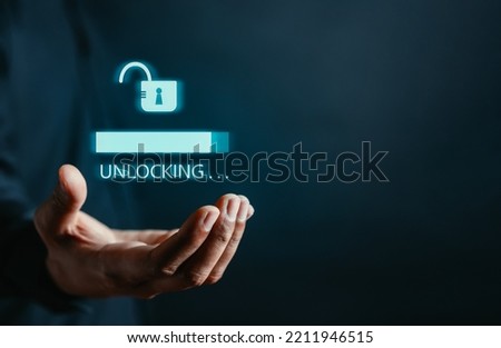 Businessman unlock success idea, creativity concept, Hand holding unlock virtual icon graphic Business innovation and technology concept. Royalty-Free Stock Photo #2211946515