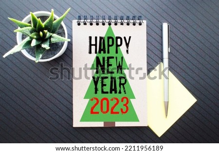 Happy New Year 2023 on wood cube block and blur abstract bokeh light background with cop space for text, Happy new year 2023 greeting card, banner