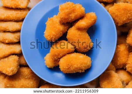 picture of chicken nuggets, made of processed meat, a tasty fast food, savory