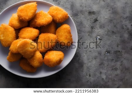 picture of chicken nuggets, made of processed meat, a tasty fast food, savory