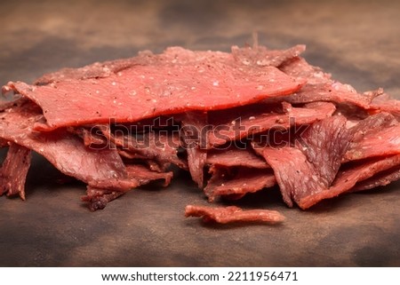 picture of beef jerky, dried meat, a food item with long shelf life