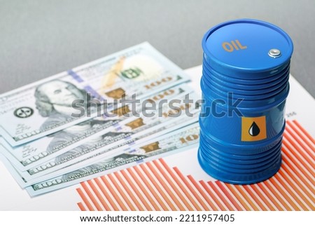 Rising oil prices. Oil barrel, chart and dollar bills.