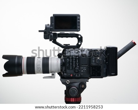 5.9k Full Frame Digital Documentary Camera on a Tripod with a 70-200mm F2.8 Zoom Lens Viewfinder top handle Compact white background V Lock Battery