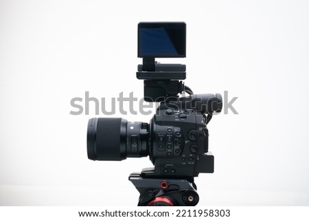 Digital Documentary Filmmaker  Camera on a Tripod with a Telephoto Photography Lens white background 85mm