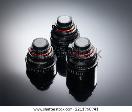 Digital Cinema Lenses Full Frame Set of 3 - 16mm F2.6 - 24mm F1.5 - 50mm F1.5 On reflective background