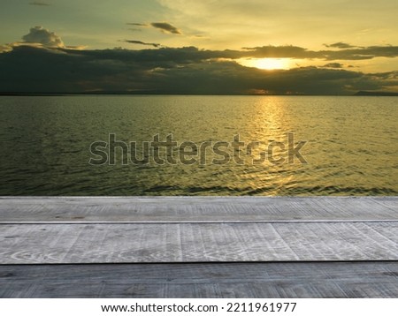 old wooden table shelf  mountain lake evening sky
