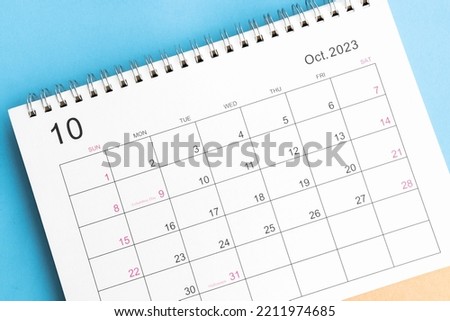calendar October 2023 top view on a blue background