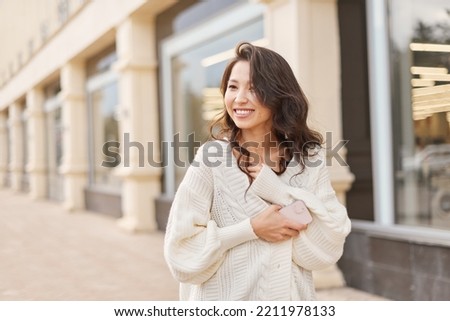 Lifestyle portrait beautiful Asian kazakh woman with brilliant smile Royalty-Free Stock Photo #2211978133