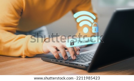Man using a computer laptop to connect to wifi and waiting to loading digital business data form website, concept technology of waiting for connect to wifi. Royalty-Free Stock Photo #2211985423