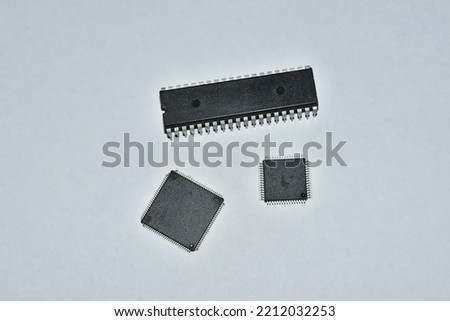Electronic components, isolated on white background, microprocessor and transistor, 8 bit Technology, 4 nm