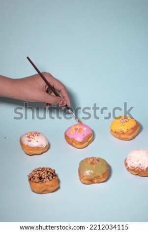 donuts with various toppings being styled