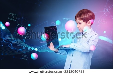 Child boy using laptop, double exposure digital hologram of spheres and blocks floating, lines and connection hud. Concept of metaverse Royalty-Free Stock Photo #2212060953