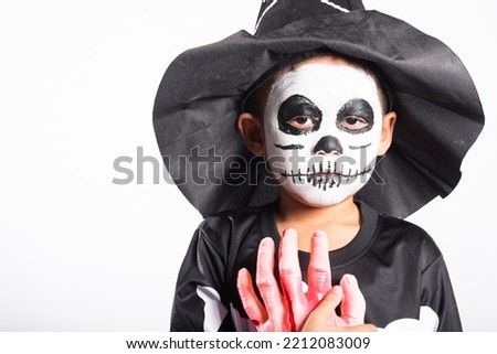 Halloween Kid. Portrait of Asian little kid boy wearing skeleton costume studio shot isolated white background, Child man horror face painting make up for scary, Happy halloween day concept