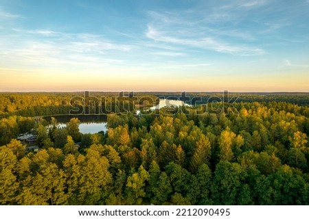 View from above of lake Wierzchowo in Poland. Green forest surrounding the lake and clear blue water Rural landscape in Poland.