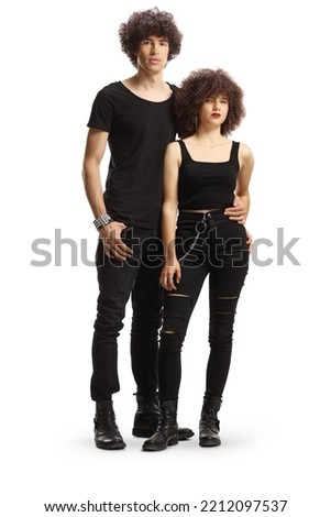 Full length portrait of a trendy young couple in black clothes isolated on white background Royalty-Free Stock Photo #2212097537