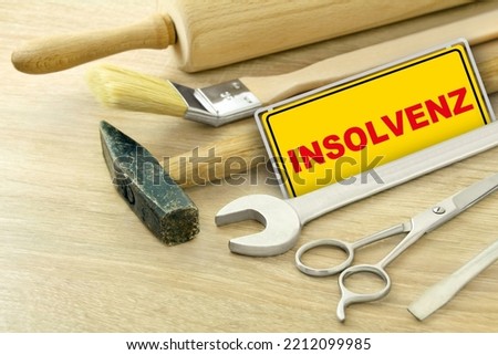 German sign as Insolvency with various tools
 Royalty-Free Stock Photo #2212099985