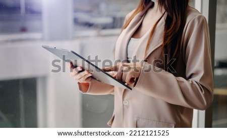 Close up image of business woman holding a digital tablet online banking, internet network communication concept

