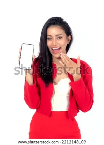Beautiful Asian brunette woman cute girl in red dress  ,Excited surprised girl showing smart phone with blank screen , white screen isolated on white background , Display Mock Up Image