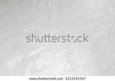 fragment of sheet of plastic transparent bubble pack close-up, texture, background of transparent packaging film