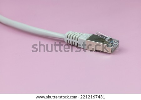 network cable rj 45, isolated on color  background Royalty-Free Stock Photo #2212167431