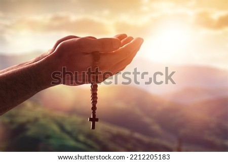 Hands of a prayed person for hope from God