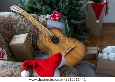 Guitar with decorated Christmas Tree in the background