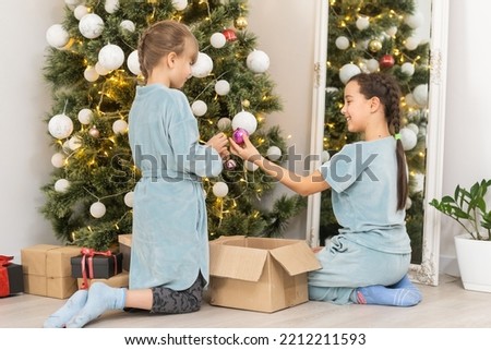 Two little girls at christmas.