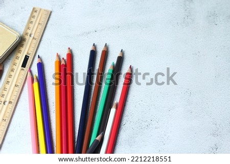 Wooden crayons scattered on the table, wooden rulers and notebooks with the festival back to the semester, students go to school, art lessons.