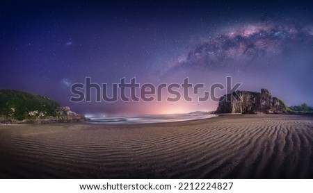 Panoramic view of Guarita Beach and Night Sky with Milky Way and Magellanic Clouds - Torres, Rio Grande do Sul, Brazil Royalty-Free Stock Photo #2212224827