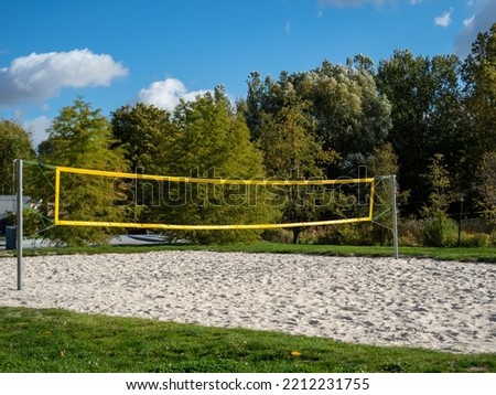 Sand volleyball court in a public city park. Volleyball Court. Royalty-Free Stock Photo #2212231755