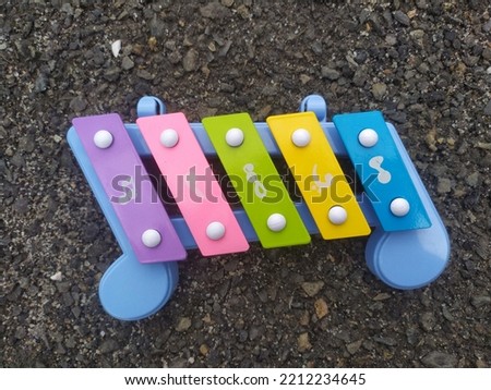 colorful xylophone musical instrument children's toys isolated on dark background, random focus