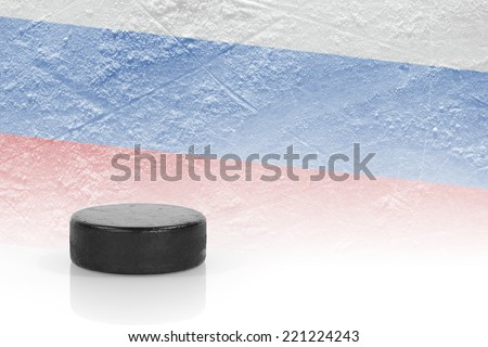 Hockey puck and the image of the Russian flag. 