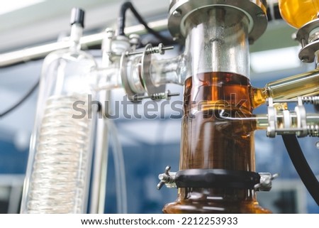 Cannabis ganja CBD oil scientific extraction machine, medicine factory technology for scientist worker in work of hemp plants process laboratory. chemical production equipment concept Royalty-Free Stock Photo #2212253933