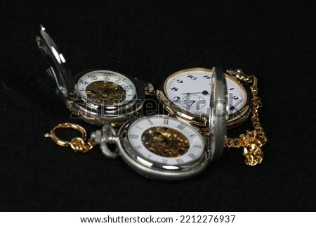 pocket watches old and new with and without movement shown Royalty-Free Stock Photo #2212276937