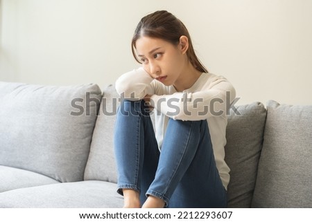 Sad, unhappy. Alone asian young woman, girl expression face thinking about problem, difficulty, feeling failure and exhausted, suffering from loneliness, grief sorrow and bad relationship or break up. Royalty-Free Stock Photo #2212293607