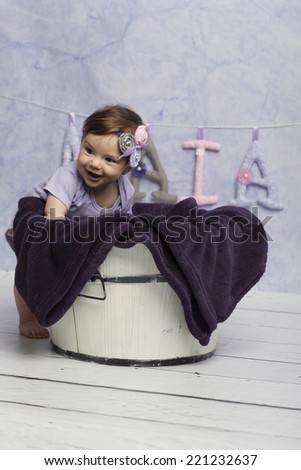 Smiling Baby Girl near tub