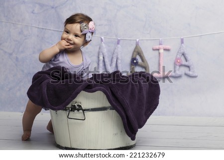 Smiling Baby Girl near tub