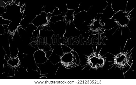 Set of broken glass on a black background. Shrapnel breaking through the window. Cracked window texture, damage concept