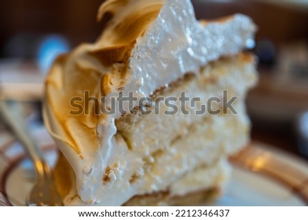 Close up of delicious soft vanilla meringue, italian dessert in selective focus